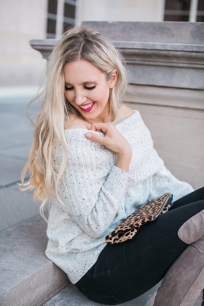 blush and camo, over the shoulder sweater, over the knee boots, black jeans, blonde hair, clare v, clare v clutch