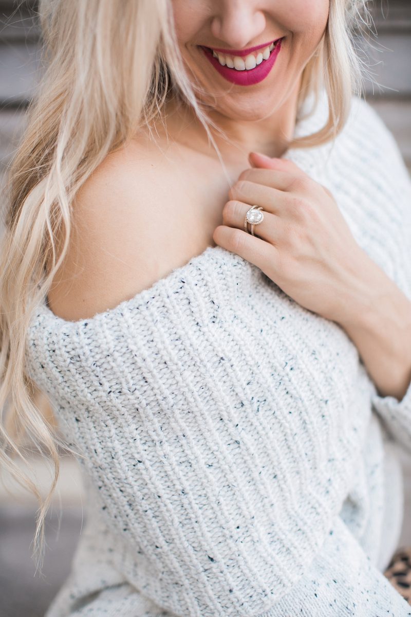 blush and camo, over the shoulder sweater, over the knee boots, black jeans, blonde hair, clare v, clare v clutch